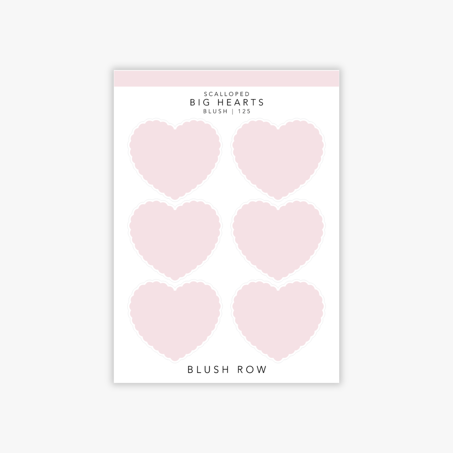 Big heart shaped planner stickers in a pink shade with scalloped edging on a Blush Row sticker sheet.