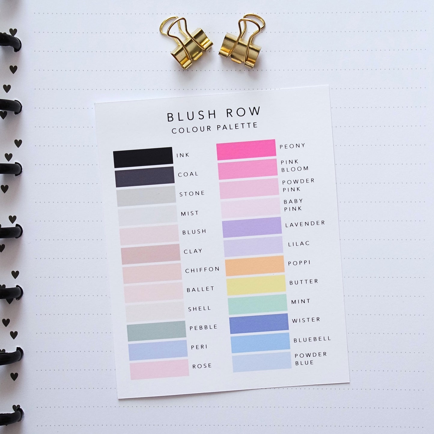 Blush Row color palette card displaying soft neutral and pastel shades with labeled swatches, placed on a dotted planner page with gold binder clips above.